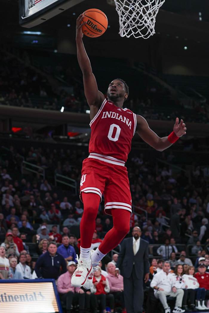  Indiana Hoosiers guard Xavier Johnson (0) lays the ball up during the second half against the Louisville Cardinals at Madison Square Garden. 